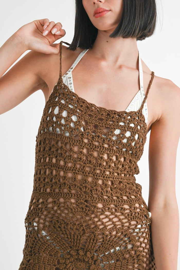 Brown crochet dress worn by a model on a white background