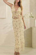Woman wearing a floral dress in a minimal indoor setting